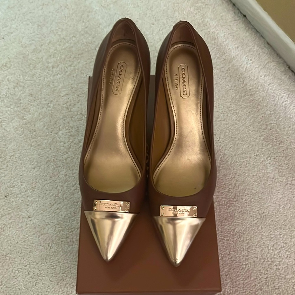 Coach brown heels with gold toe.